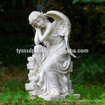 Stone hand carved garden sitting angel with wings sculpture